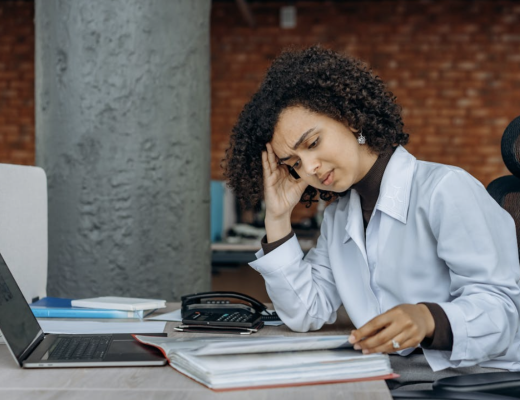 Frustrated Woman Looking at Her Business Finances